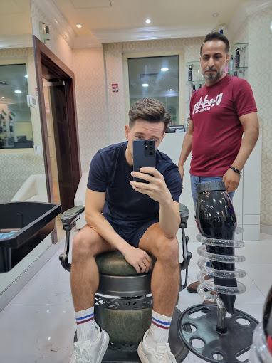 Luxury grooming experience Dubai - Modern salon interior with waterfront views